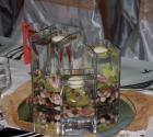 Aranjament pentru masa invitatilor in boluri de sticla cu orhidee 